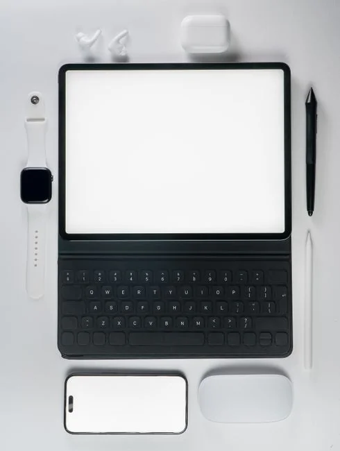A stylish workspace featuring a laptop and monitors displaying design software.